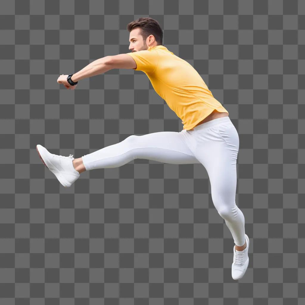 Man in white pants jumping with a yellow shirt