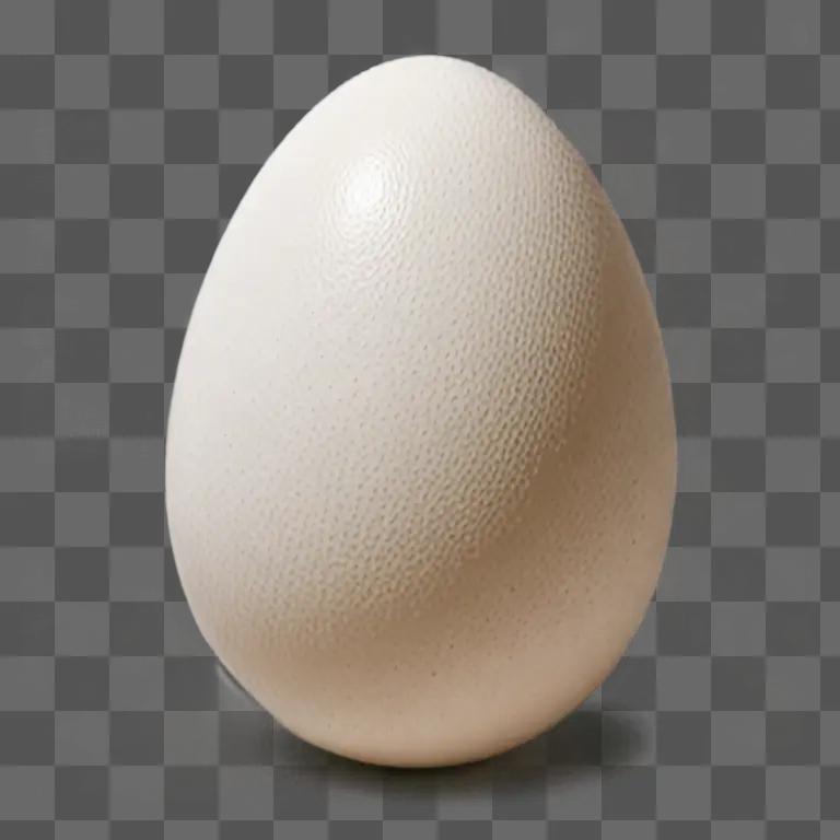 A white egg with small black spots on it